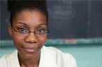 Woman in front of chalkboard