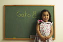 Girl in front of blackboard