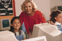 Woman and girl on computer